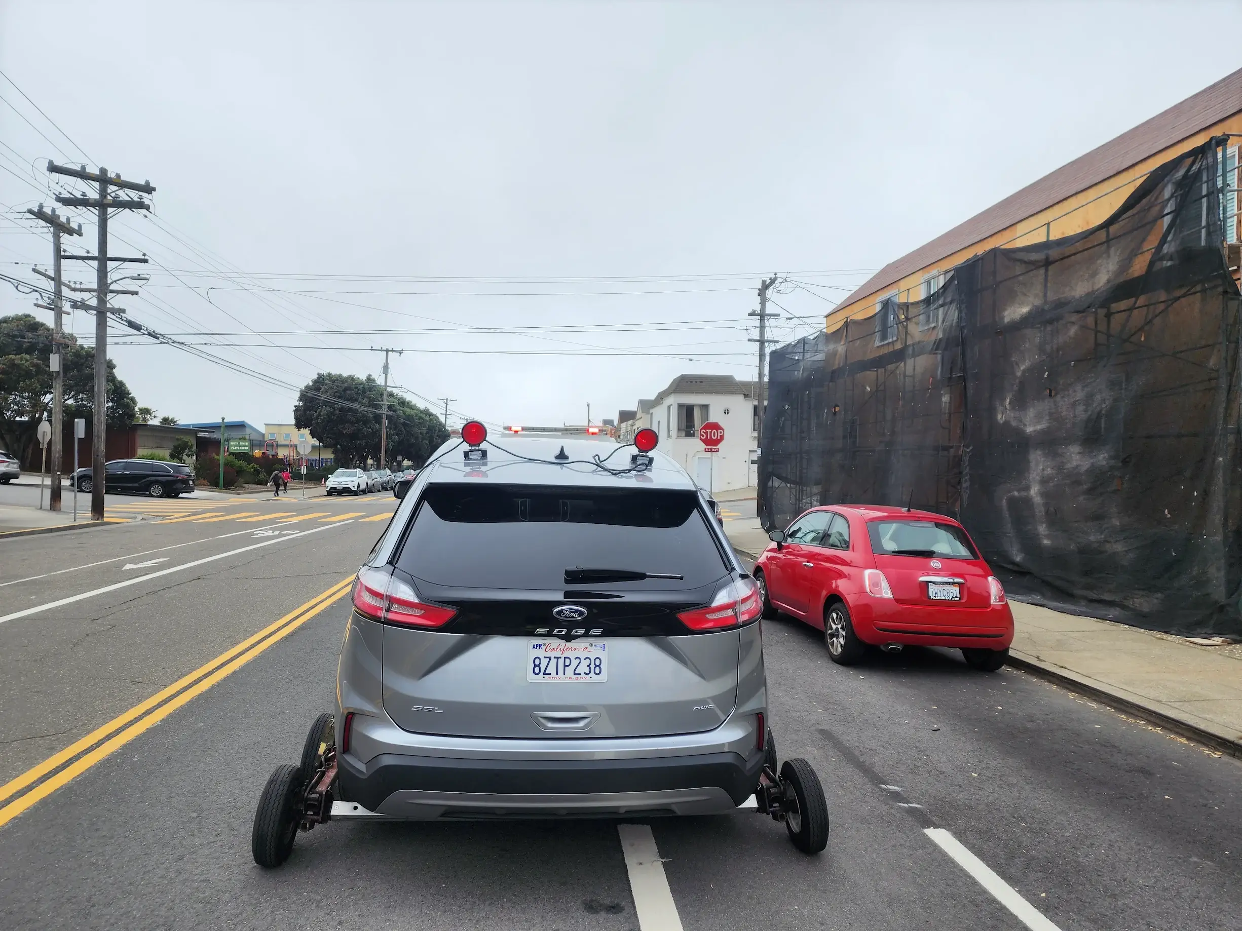 A car is parked on the side of the road.