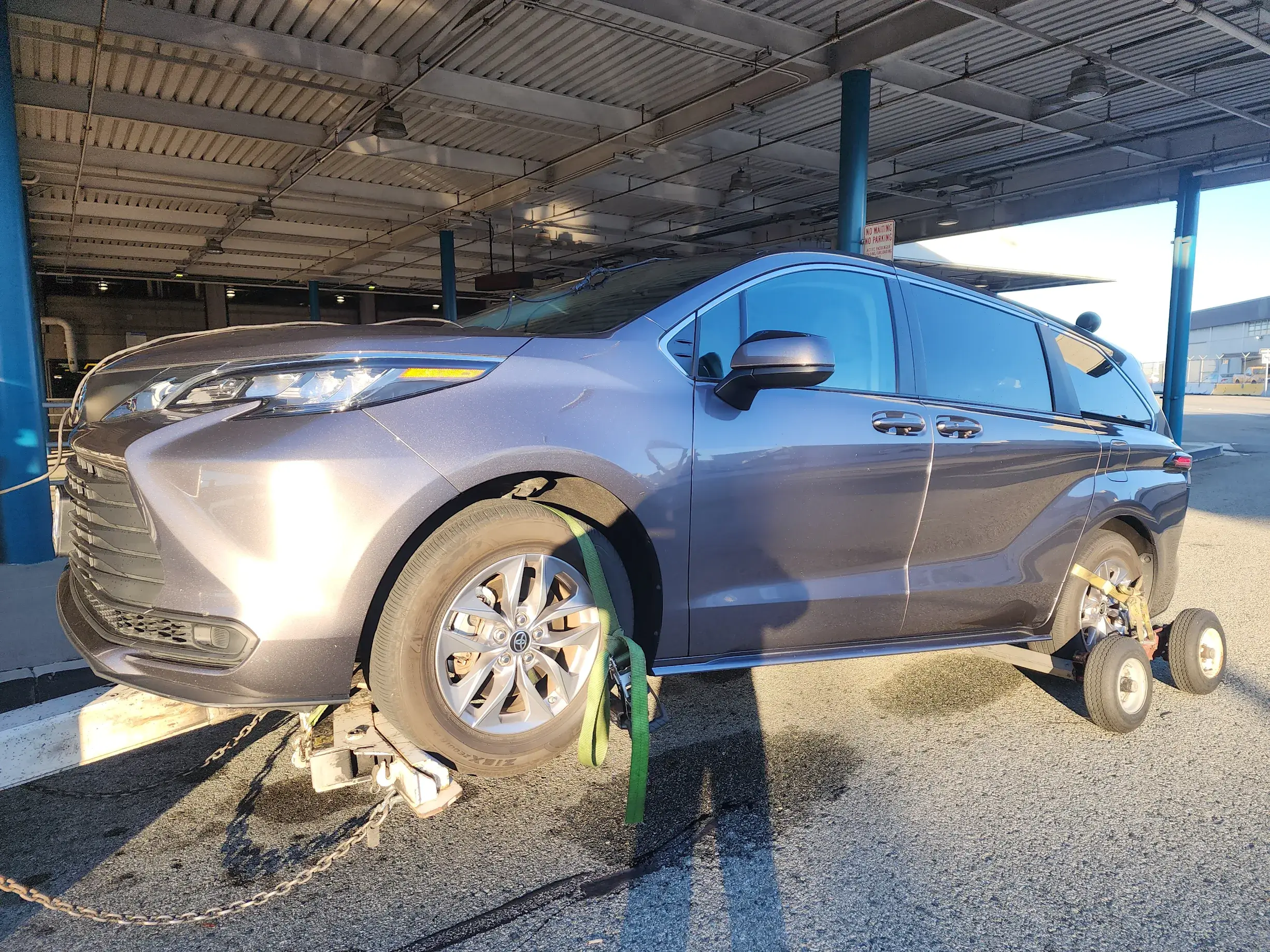 A silver car is parked in the garage
