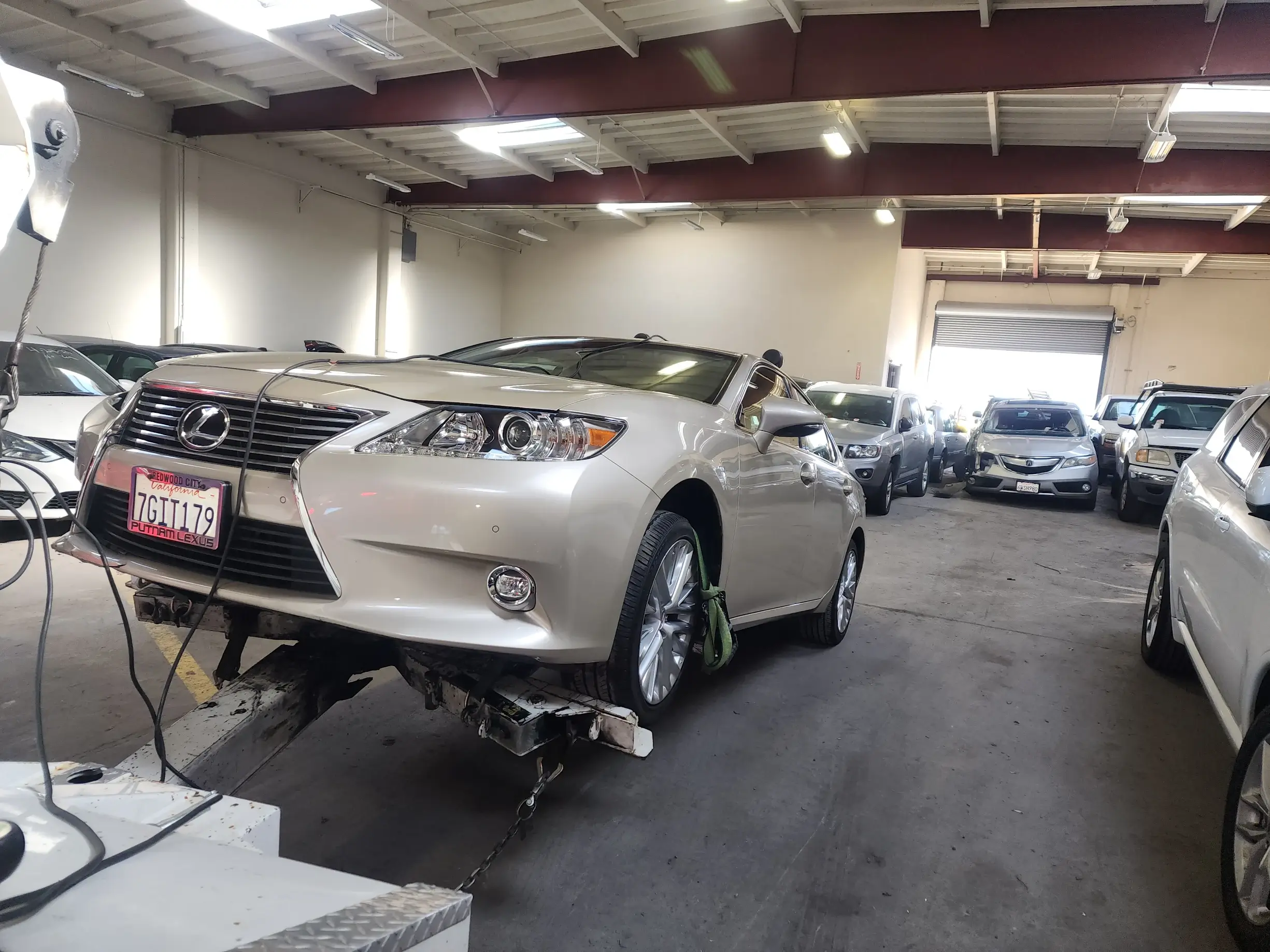 A car is being worked on in the garage.
