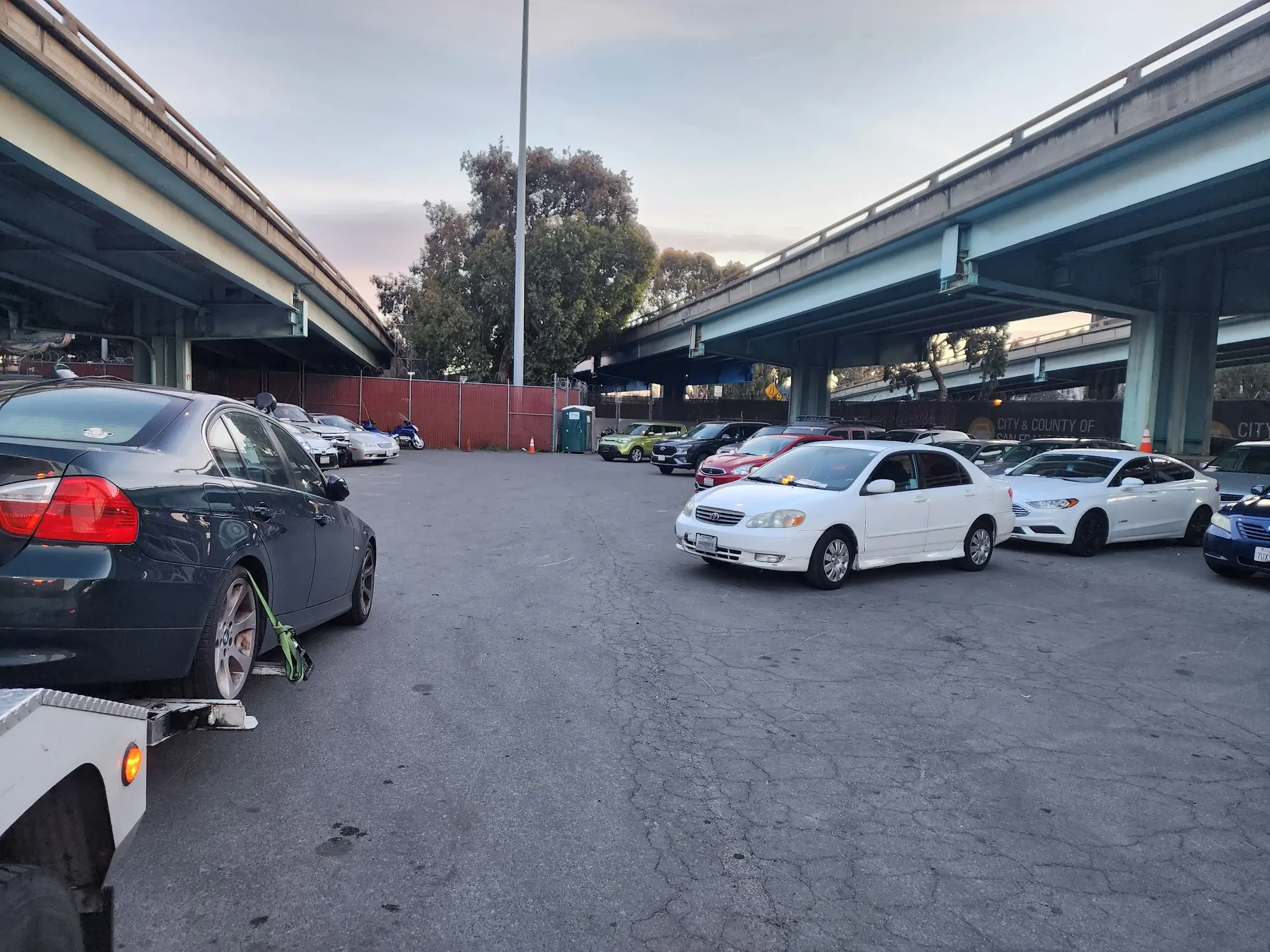A parking lot with several cars parked on it.