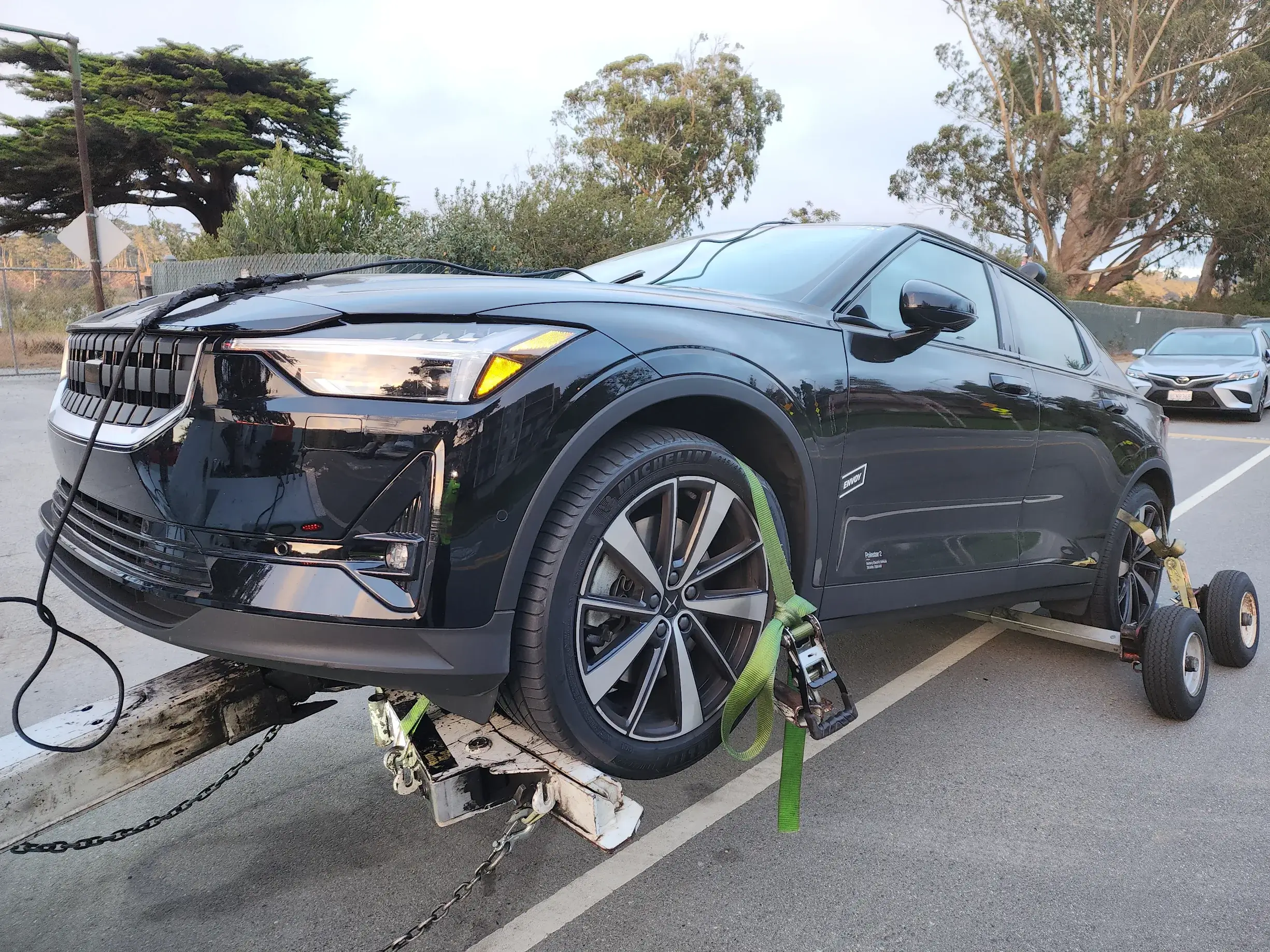 A black car that is on the ground