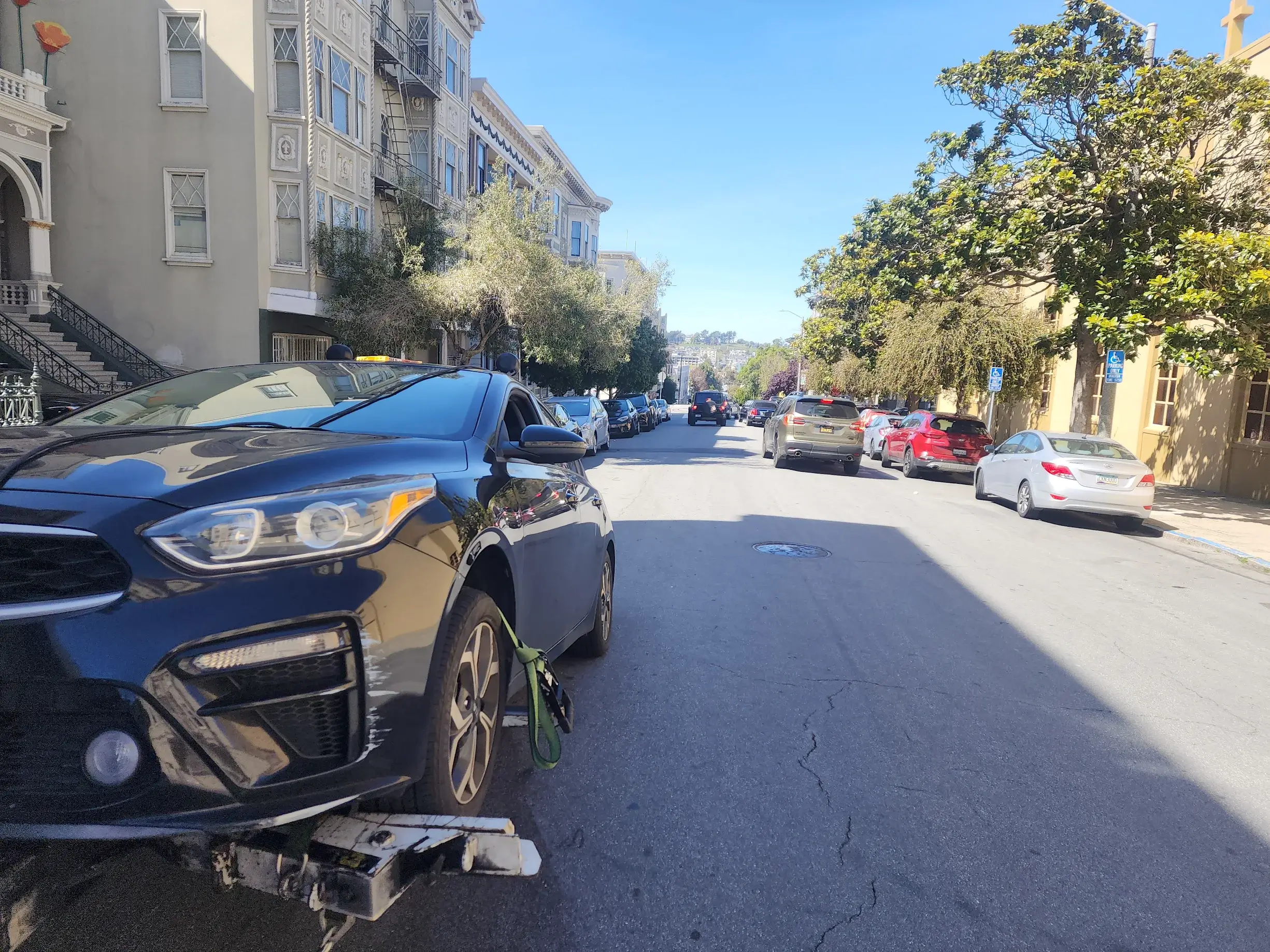 A car that has been knocked over by another vehicle.